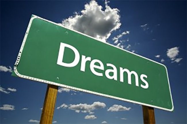 stock photo of a green sign that says dreams
