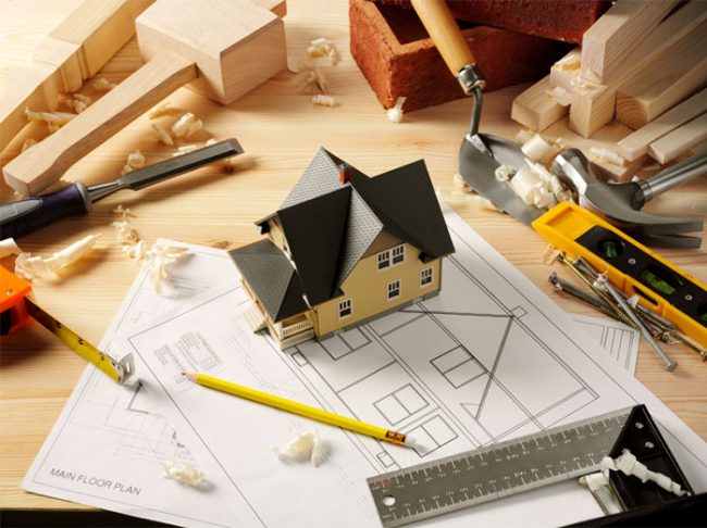 renovation plans with construction tools