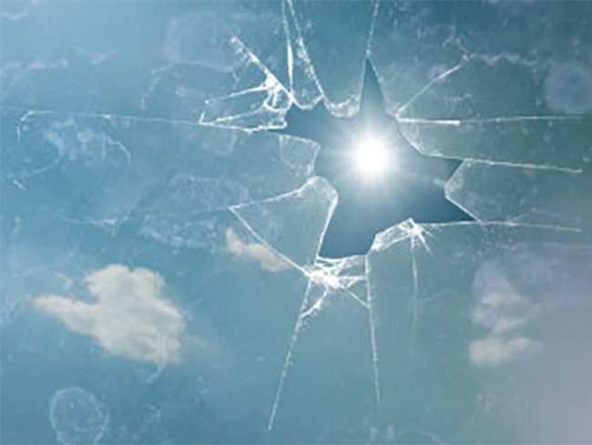 broken piece of glass with the sun piercing through - breaking mortgage early