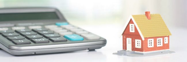 Tiny house beside a large mortgage calculator