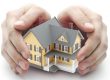 hands around house insurance
